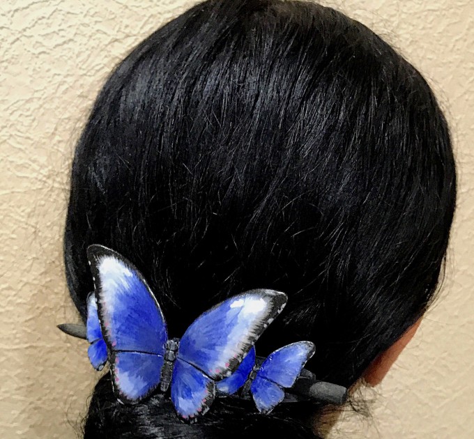 Wooden hair barrette with butterflies.