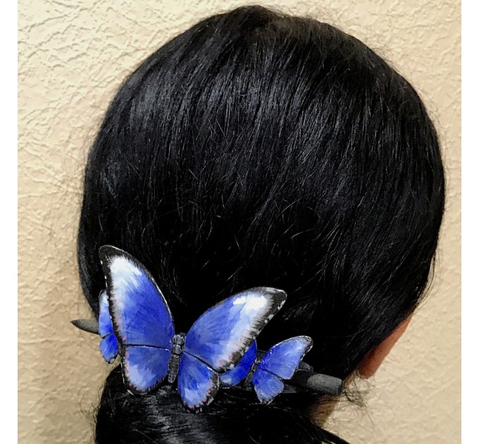 Wooden hair barrette with butterflies.