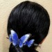 Wooden hair barrette with butterflies.