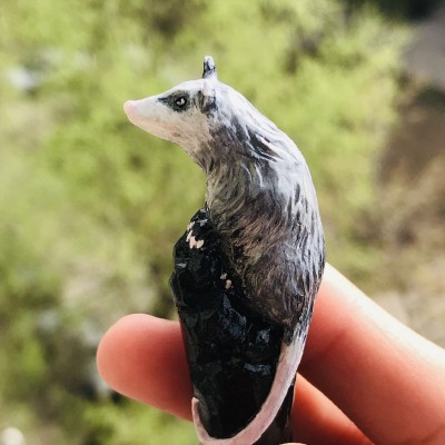 Carved wooden hair stick with Opossum