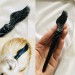 Carved wooden hair stick with black bird  wing, Raven wing