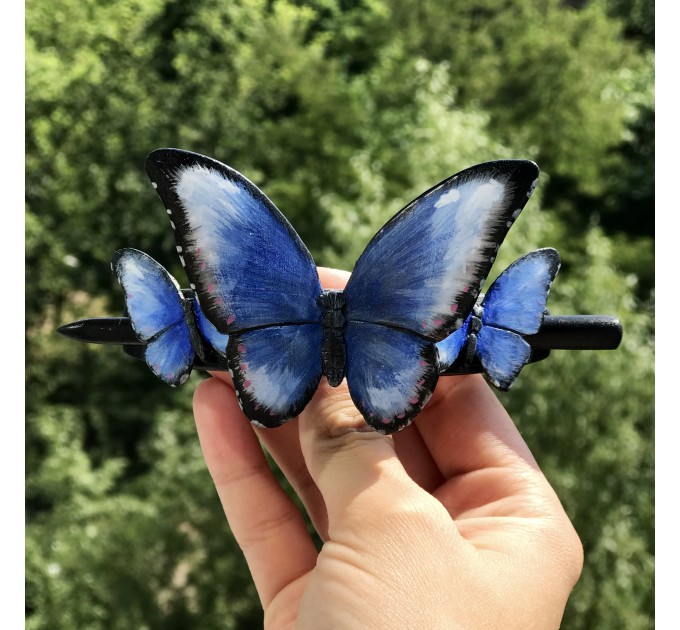 Wooden hair barrette with butterflies.