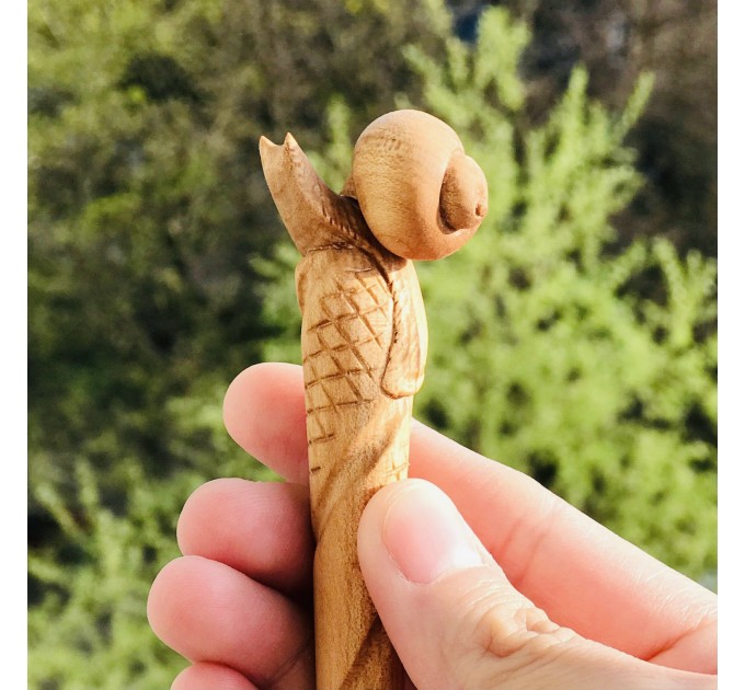 Carved wooden hair stick with snail