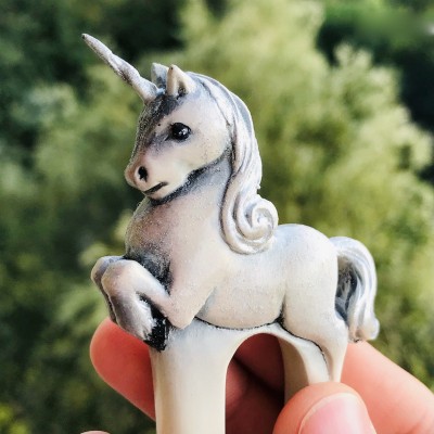 Carved wooden hair fork with white baby unicorn