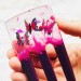 Purple resin hair fork with pink butterflies