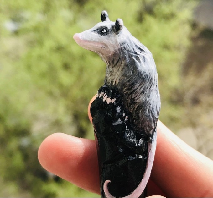 Carved wooden hair stick with Opossum