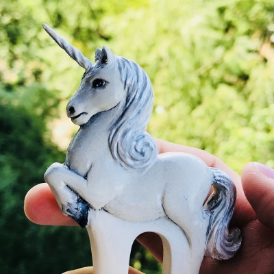 Carved wooden hair fork with white unicorn
