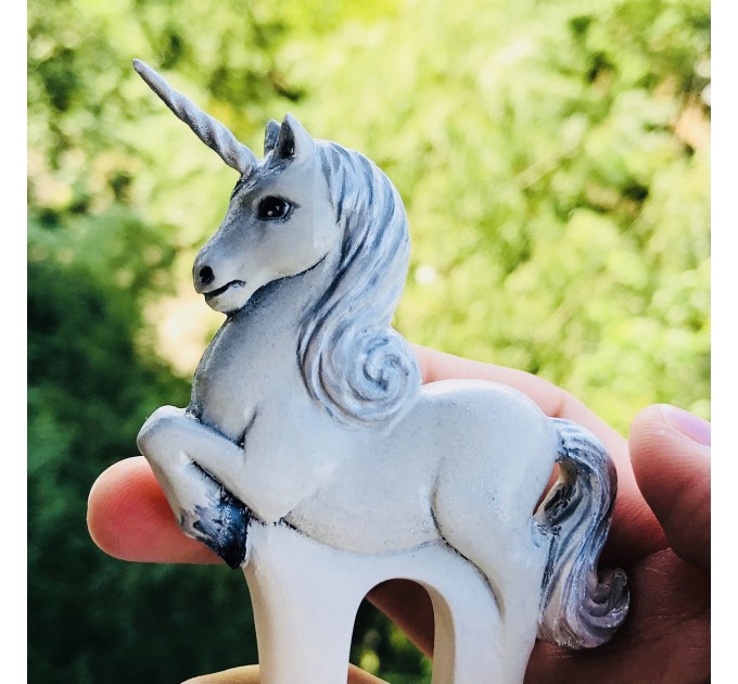 Carved wooden hair fork with white unicorn