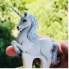 Carved wooden hair fork with white unicorn