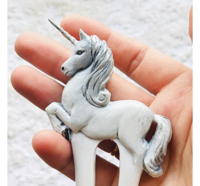 Carved wooden hair fork with white unicorn