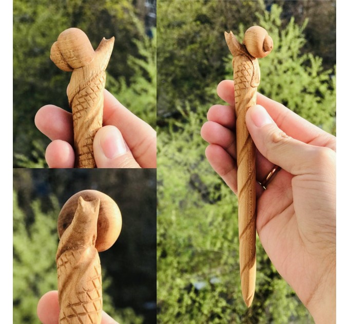 Carved wooden hair stick with snail