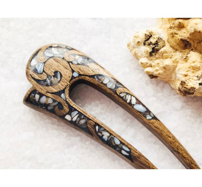 Wooden hair fork with gray stones 