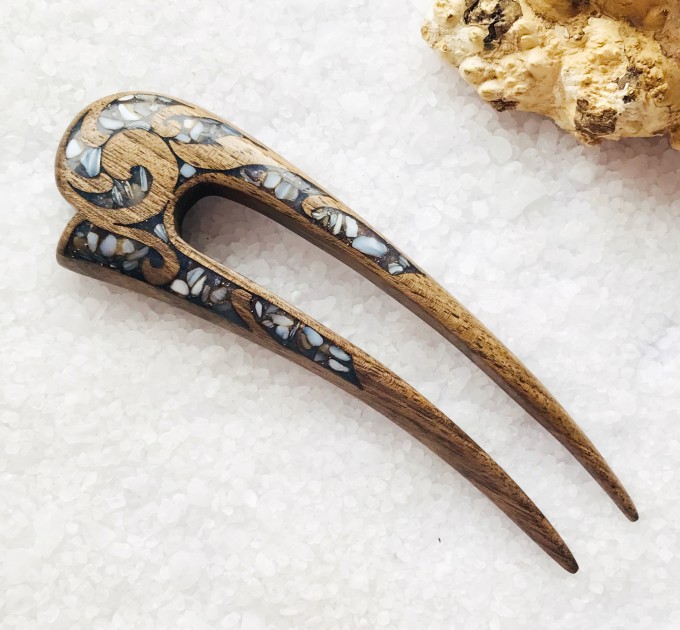 Wooden hair fork with gray stones 