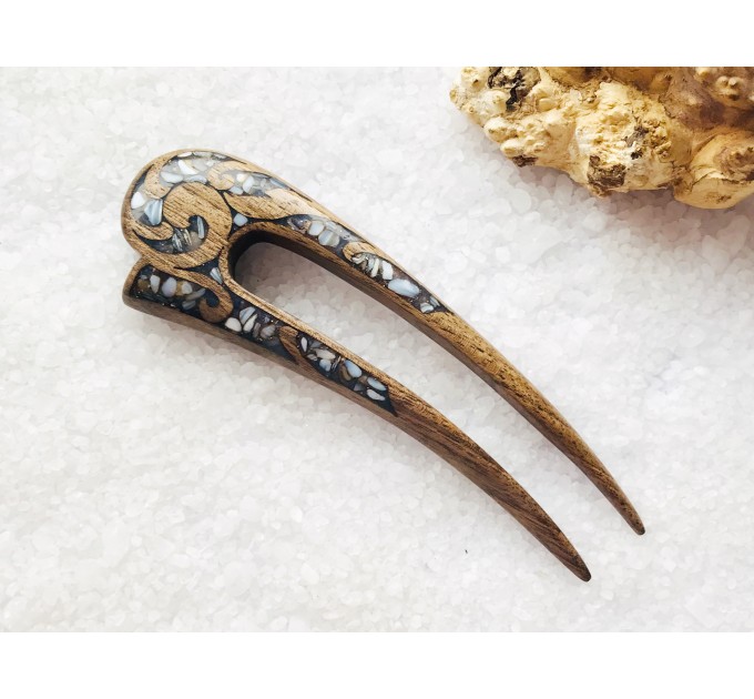 Wooden hair fork with gray stones 