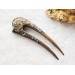 Wooden hair fork with gray stones 