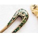 Wooden hair fork with green stones 